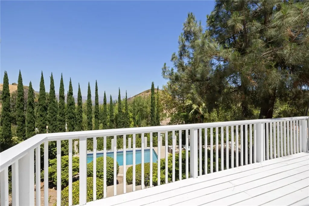 Enter deck from living area, overlooking pool and canyon/city views