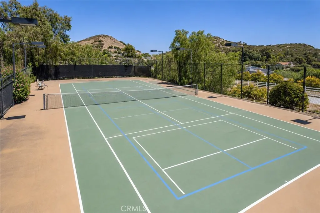 Tennis court that can be used as a pickleball court as well.