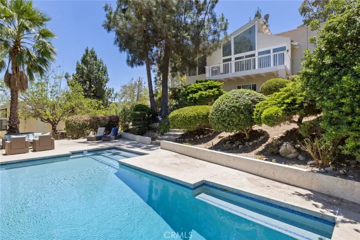 Pool view up to house