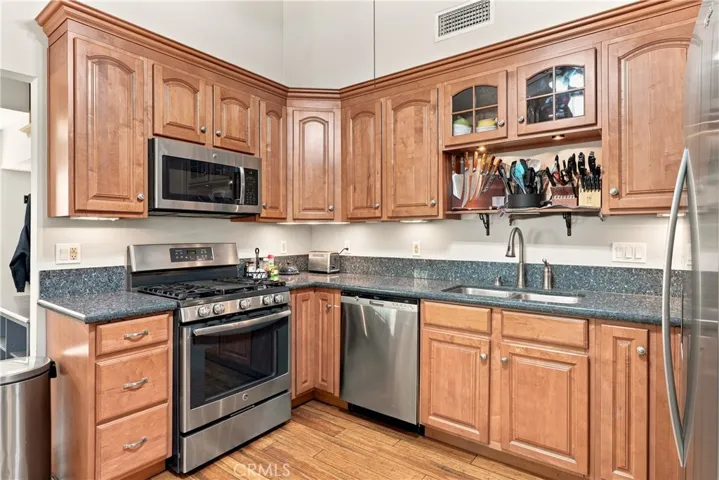 Granite countertops and stainless steel appliances make for a clean look.