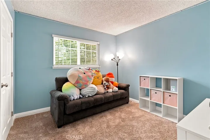 Bedrooms 2 is at the front of the hallway and features plush carpet.