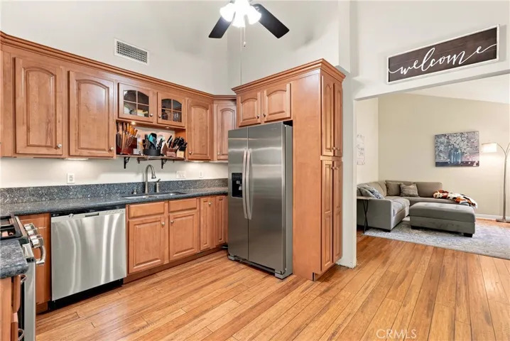 Vaulted ceilings give the kitchen a lofty feeling. Bonus, the refrigerator stays!