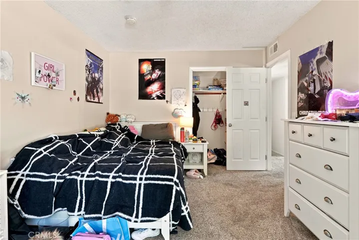 Bedroom 3 features a sliding glass door that leads out to the backyard.