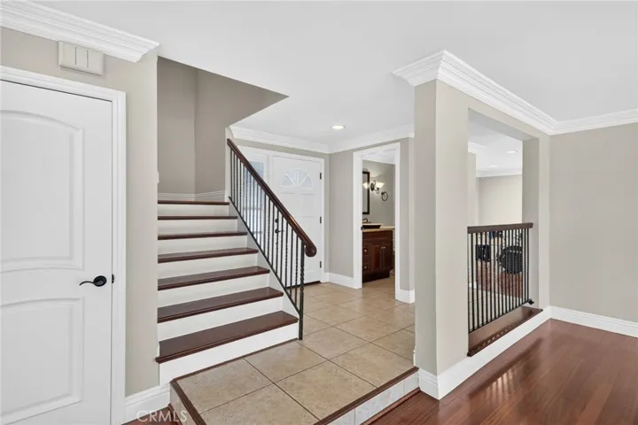1/2 Bathroom Downstairs, and stairway leads to four upstairs bedrooms and bathrooms.