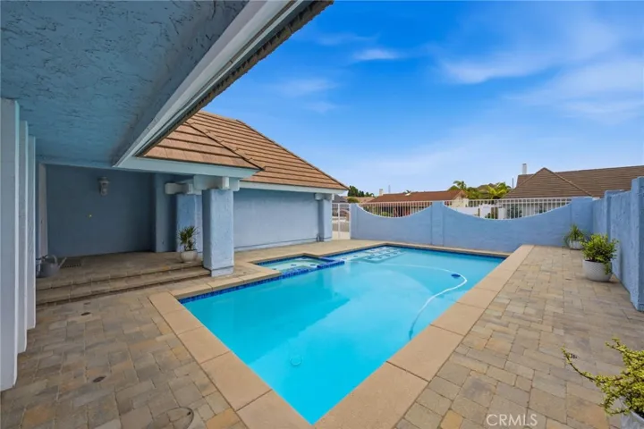 Courtyard walls provide separation and privacy around the pool area.