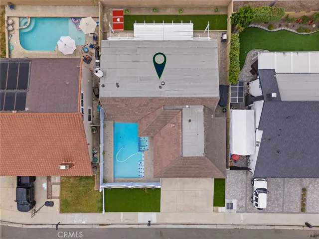 Overhead perspective showcasing the front courtyard pool and backyard.