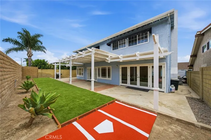 Two sets of double doors to the backyard.