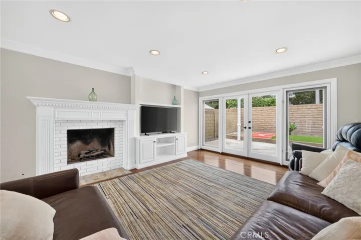 Separate living and family rooms offer flexibility for multiple uses.
