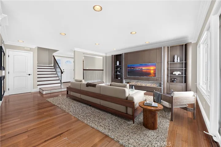 Open living space offers flexibility for relaxing and entertaining. Virtually staged
