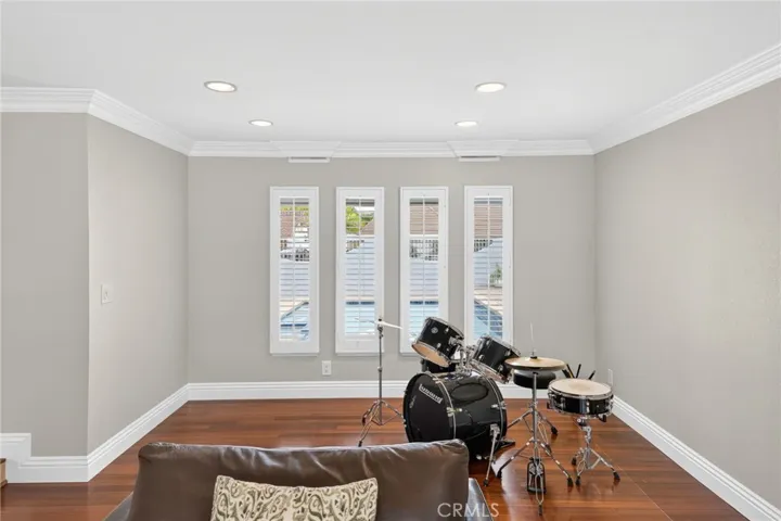 Natural light enhances the bright and open living space looking out over the pool/counrtyard.