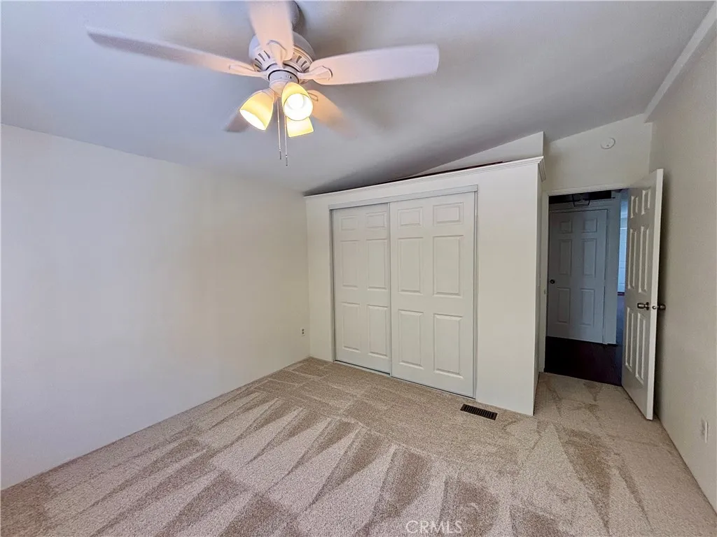 3rd bedroom with closet and new carpet