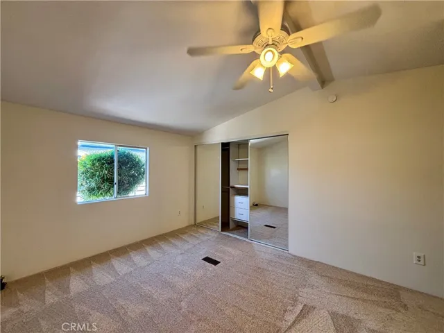 Guest bedroom with oversized closet space and new carpet