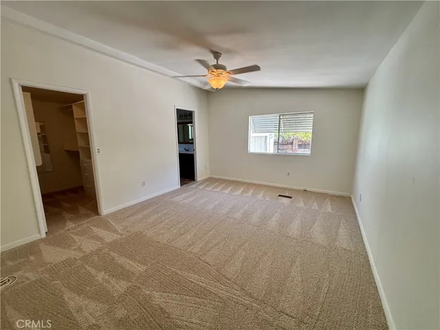 Primary suite is ample size with new carpet!
