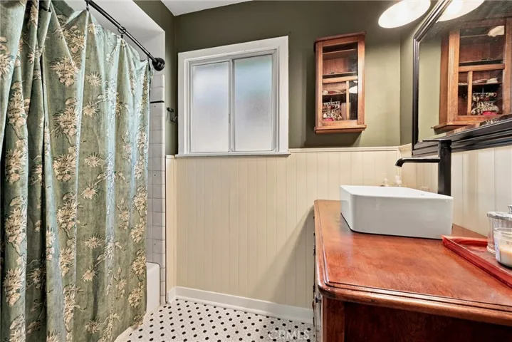 Hall bathroom with new tile flooring and vanity