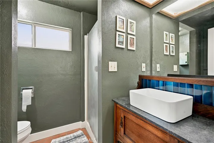 Bathroom with stall shower and new vanity