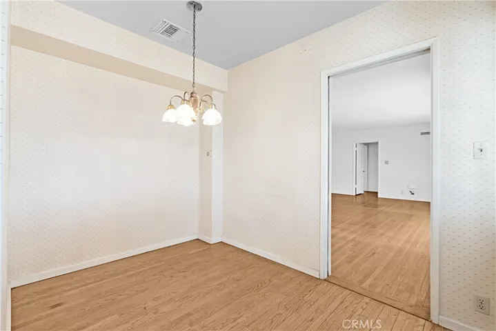 DINING AREA LOOKING INTO LIVING ROOM AREA