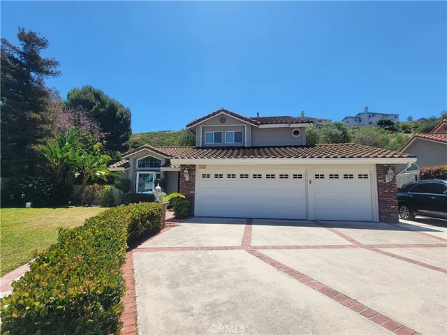 3 car garage with wide driveway
