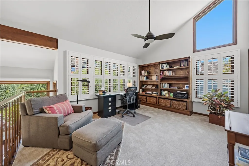 UPPER LOFT WITH ADDED CEILING FAN, BUILT-IN BOOKSHELVES