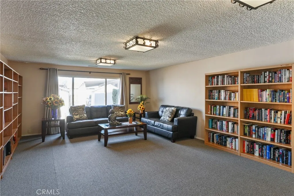 The clubhouse features an extensive library, offering a comfortable and quiet space to read and relax.