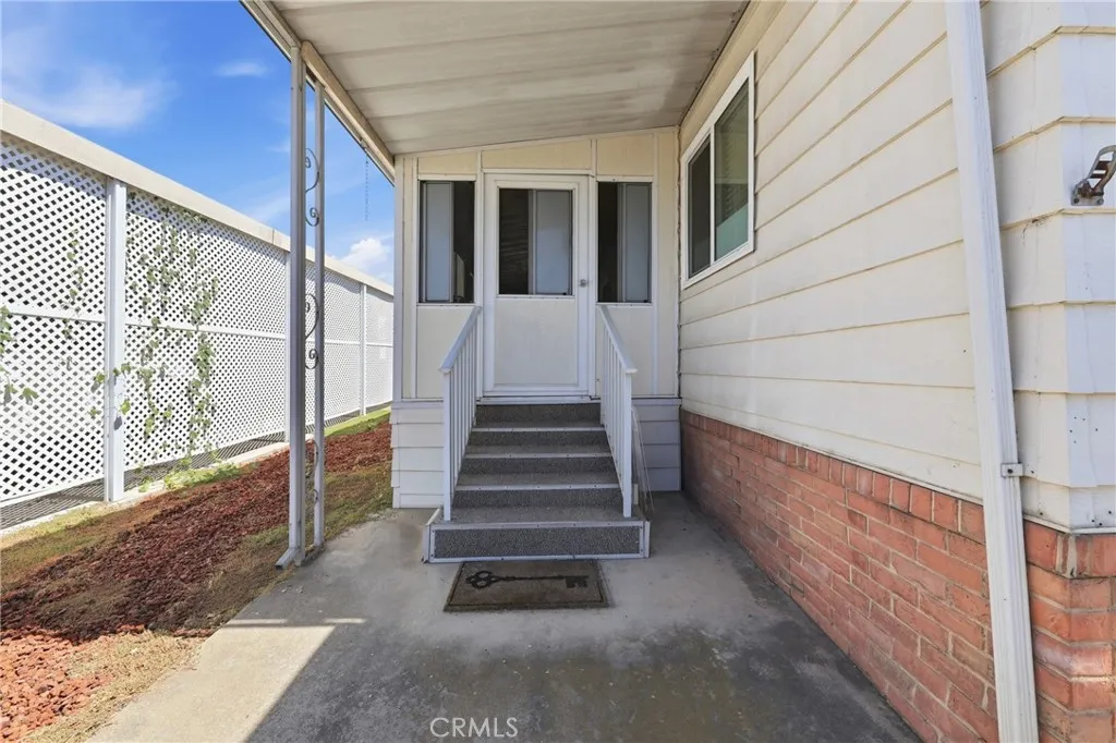front entrance, five steps lead to the home’s welcoming front entrance.