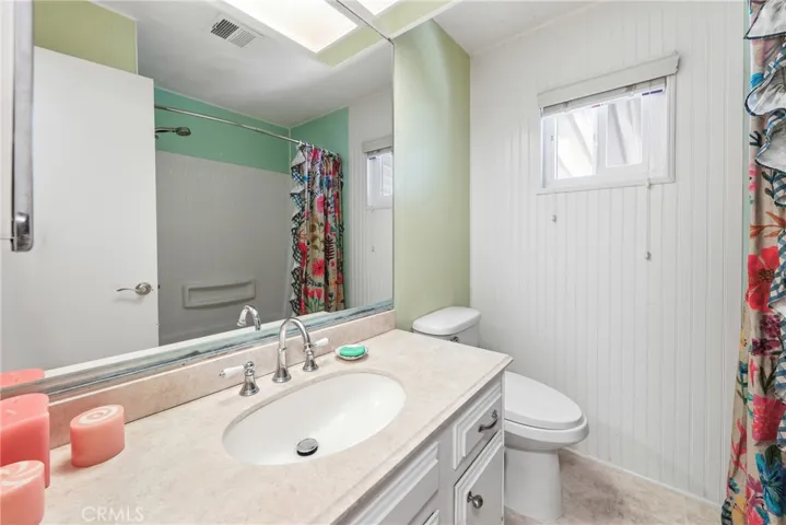 The guest bathroom features a full bath, shower in tub, and a modern bidet toilet.