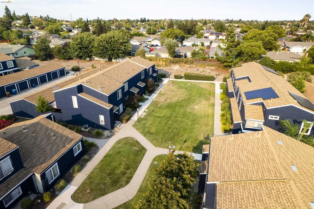Central green space surrounded by multi-unit residential buildings