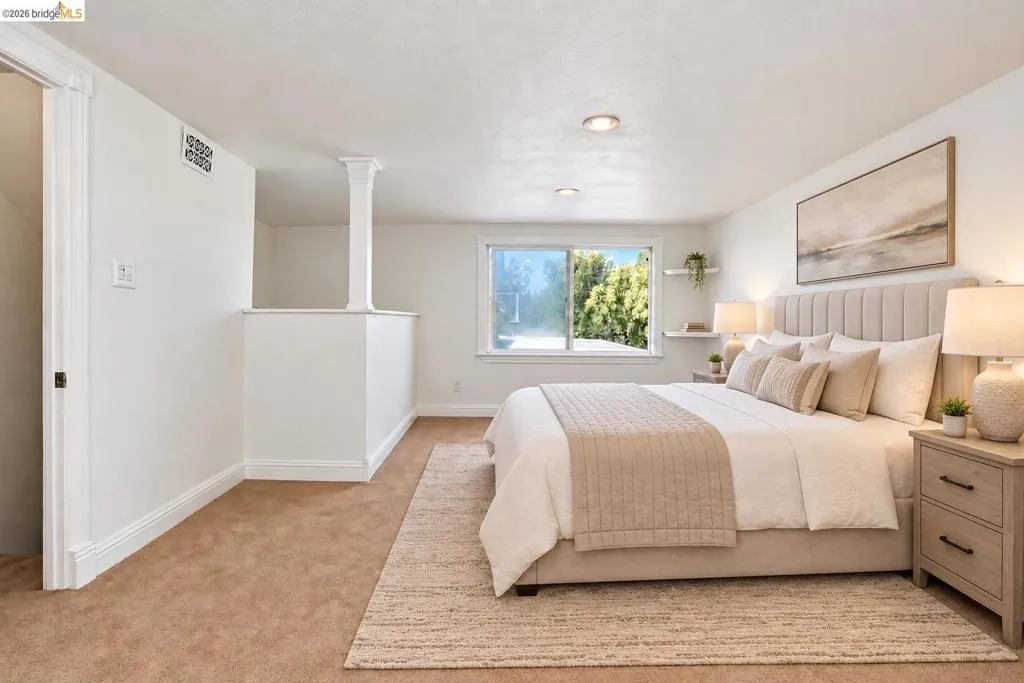Recessed lighting, wood-trim windows, and wall shelving
