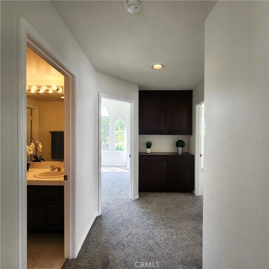 Upper level hall with linen cabinets.
