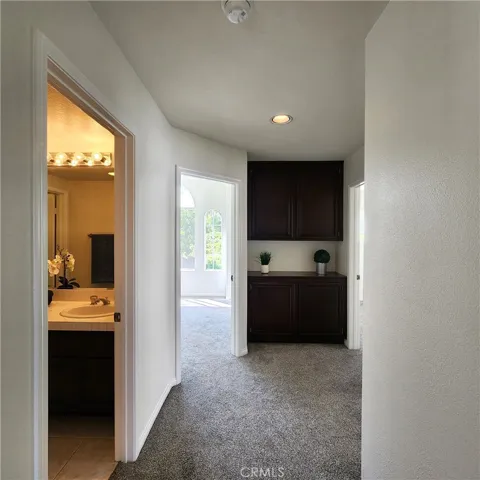Upper level hall with linen cabinets.