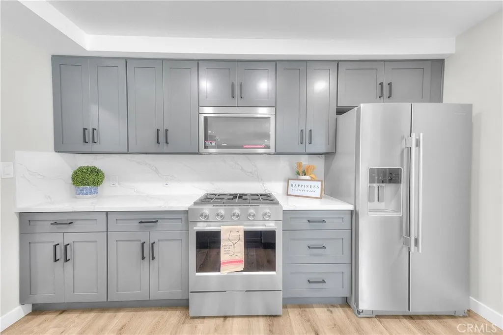 Kitchen: New Quartz countertop. New cabinetry, New KitchenAid Appliances.