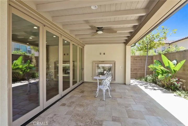 back yard california room w/ fireplace