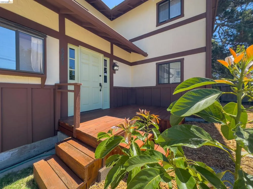 Tudor-style exterior with contrasting brown trim and light-colored stucco