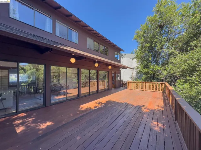 Expansive wood deck with natural wood railing