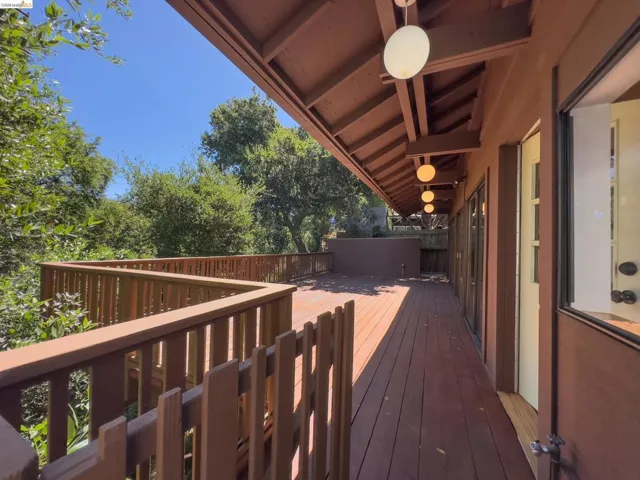 Expansive wood-finish deck with perimeter railing