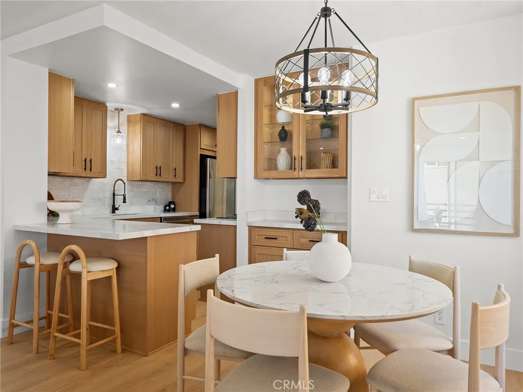 The dining area is comfortably close to the kitchen and benefits from the open airflow of the ocean breezes.