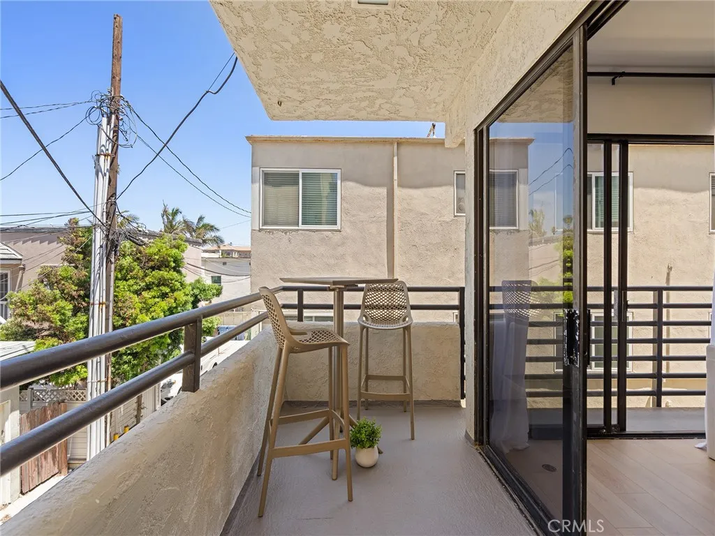 A cozy spot to enjoy the morning or evening light and ocean breezes. The balcony wraps around to the Juliet sized double slider door balcony of the living room. Do you appreciate the ocean breeze that this home offers?