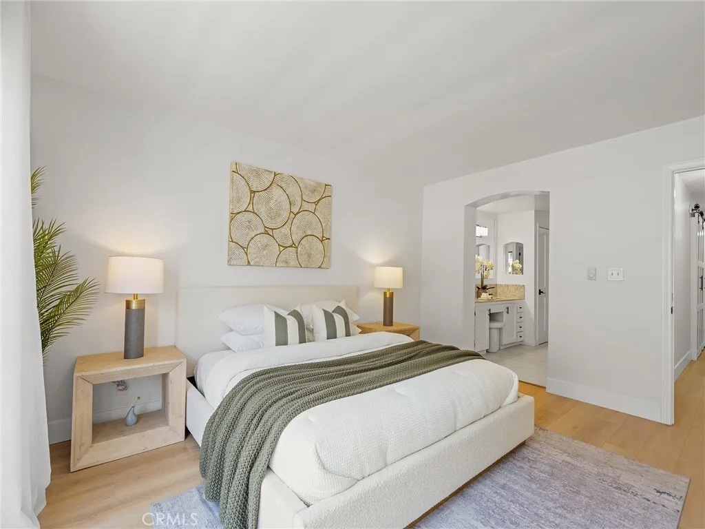 The primary bedroom suite with a dual sink bathroom and tub and shower