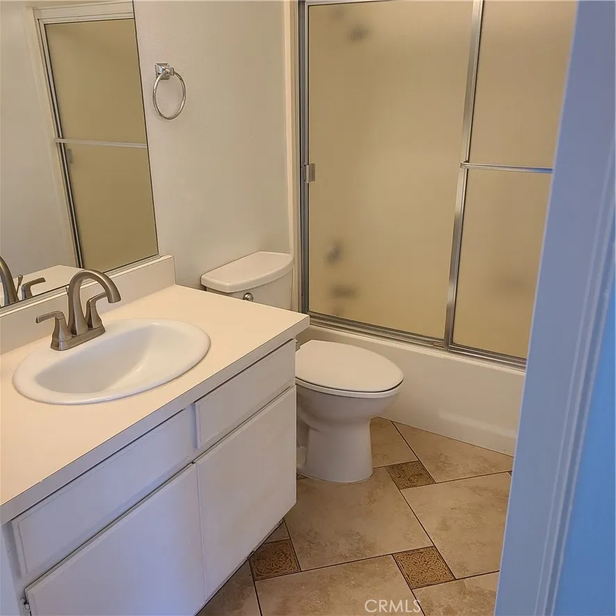 Custom tile floor in second bathroom