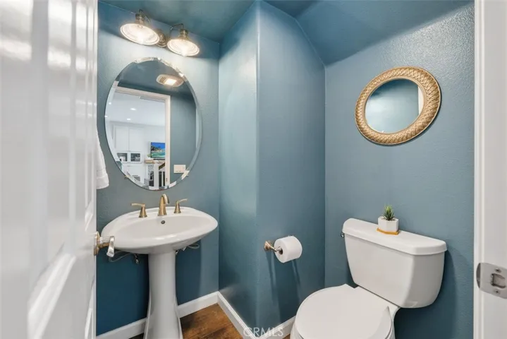 Convenient downstairs powder room for guests.