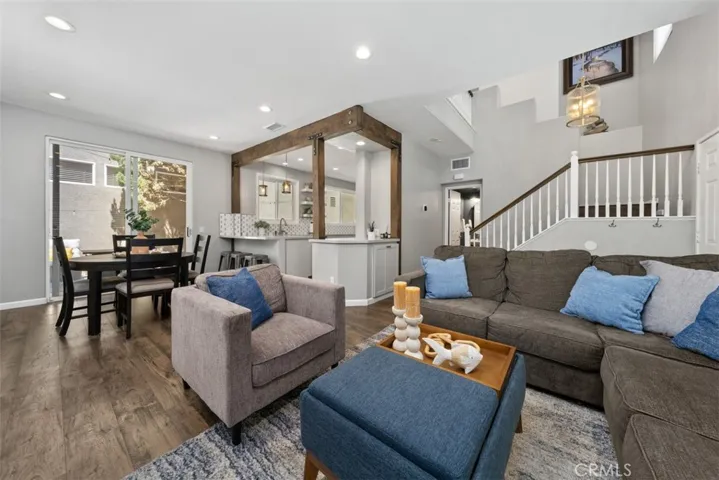Open-concept living with seamless flow between the living room, dining area, and remodeled kitchen.
