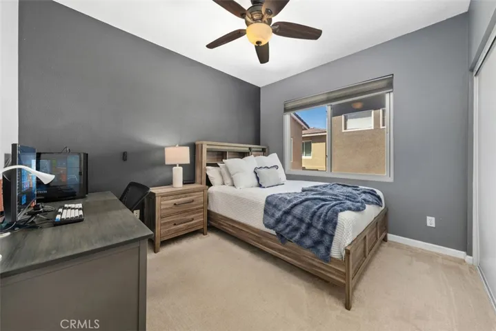 Spacious third bedroom with ample natural light and closet space