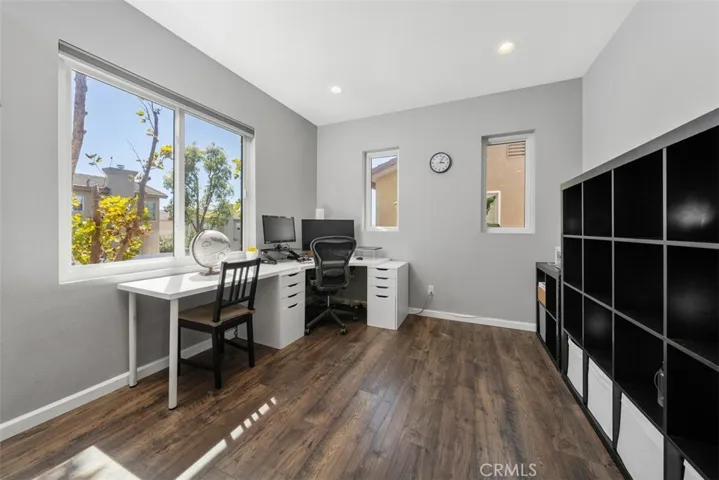 Versatile loft ideal for a home office, playroom, media room, or potential fourth bedroom conversion