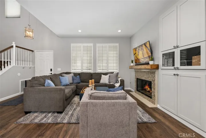 Cozy up by the remodeled fireplace, creating the perfect space to relax or entertain. Fireplace flame and television screen have been digitally enhanced
