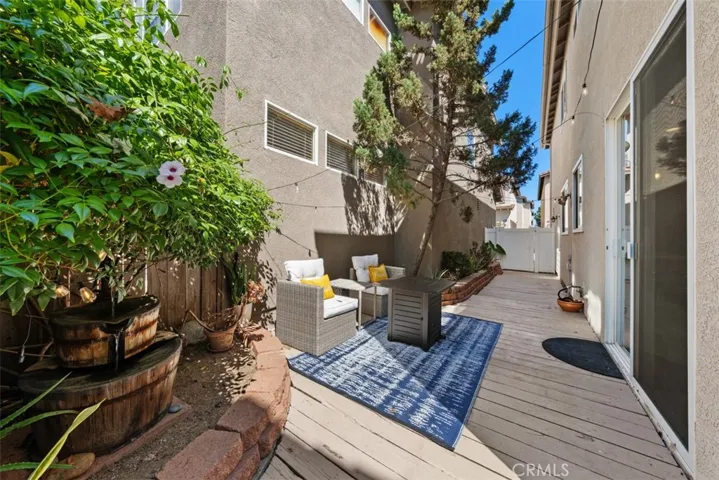 Private backyard patio provides the perfect space for outdoor dining, relaxing, or entertaining.