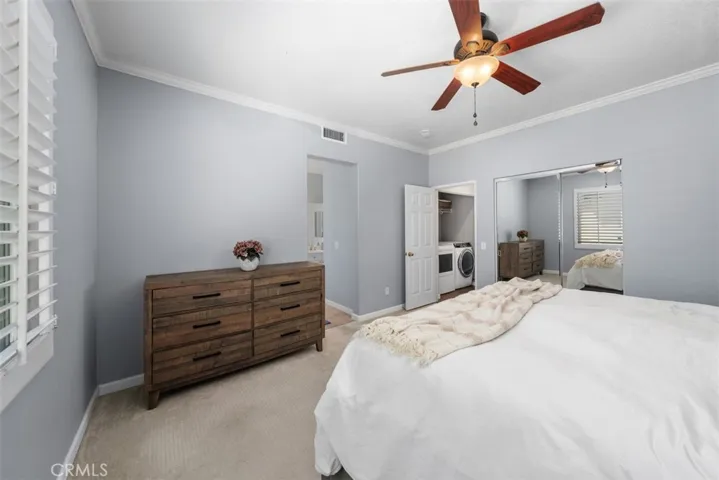 The primary suite features direct access to the ensuite bathroom and nearby upstairs laundry.