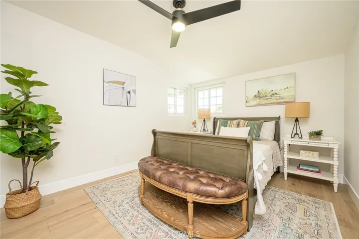 Bedroom #2 with luxury flooring and ceiling fan