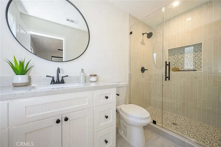 Downstairs primary bathroom with new vanity and fixtures