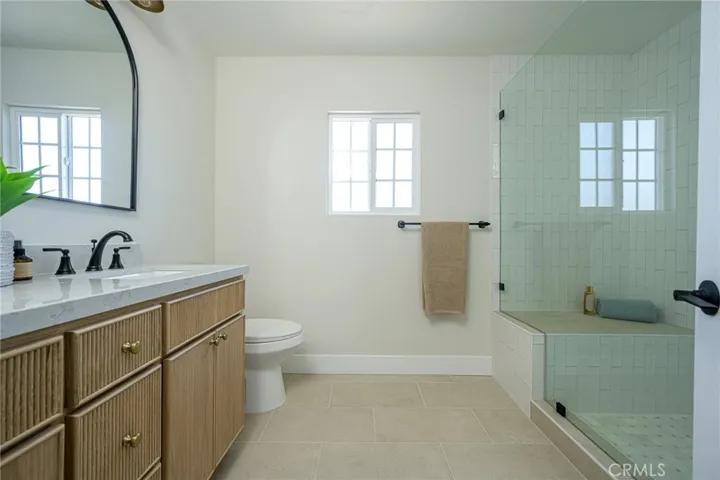 Upstairs primary bathroom with new double sink vanity and fixtures