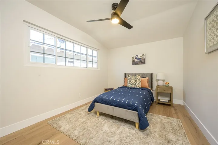 Bedroom #3 with luxury flooring and ceiling fan