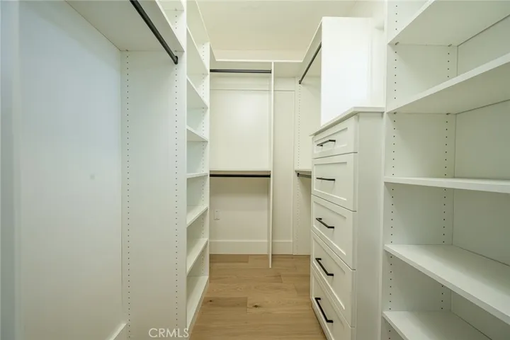 Walk in closet with custom built ins